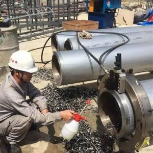 Automated pipe beveling machine in action at Dexter Steel factory