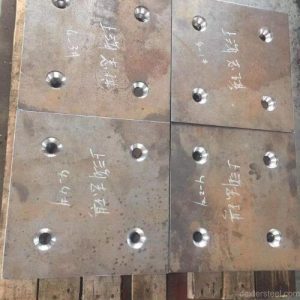 precisely drilled hole pattern on a steel plate